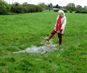 Isabel having fun in the puddle